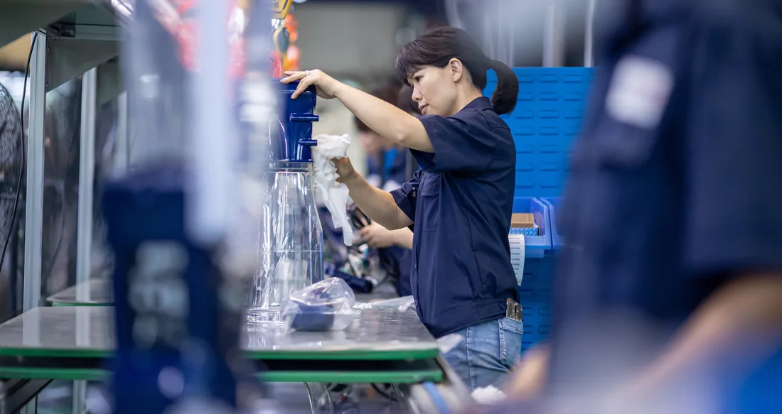 Technician performing post-molding assembly
