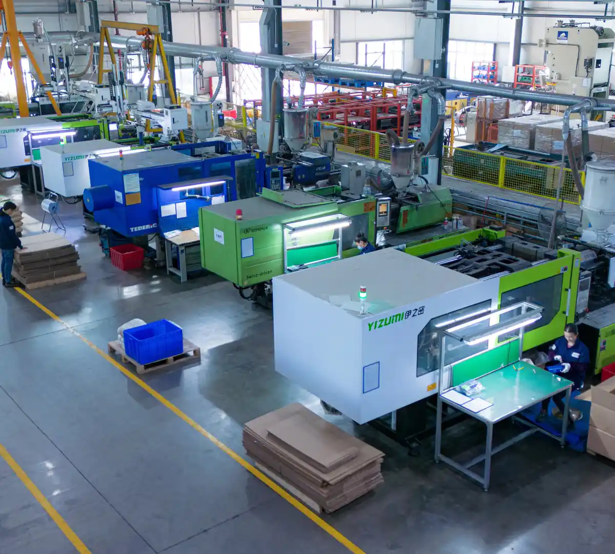 Aerial view of Komaspec's plastic injection molding press floor