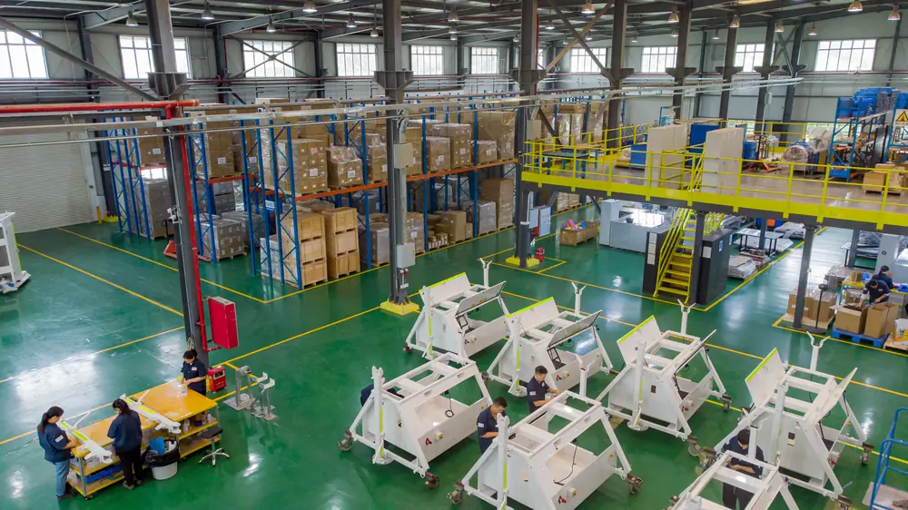 Multi-region contract manufacturing and assembly plant operations at Komaspec
